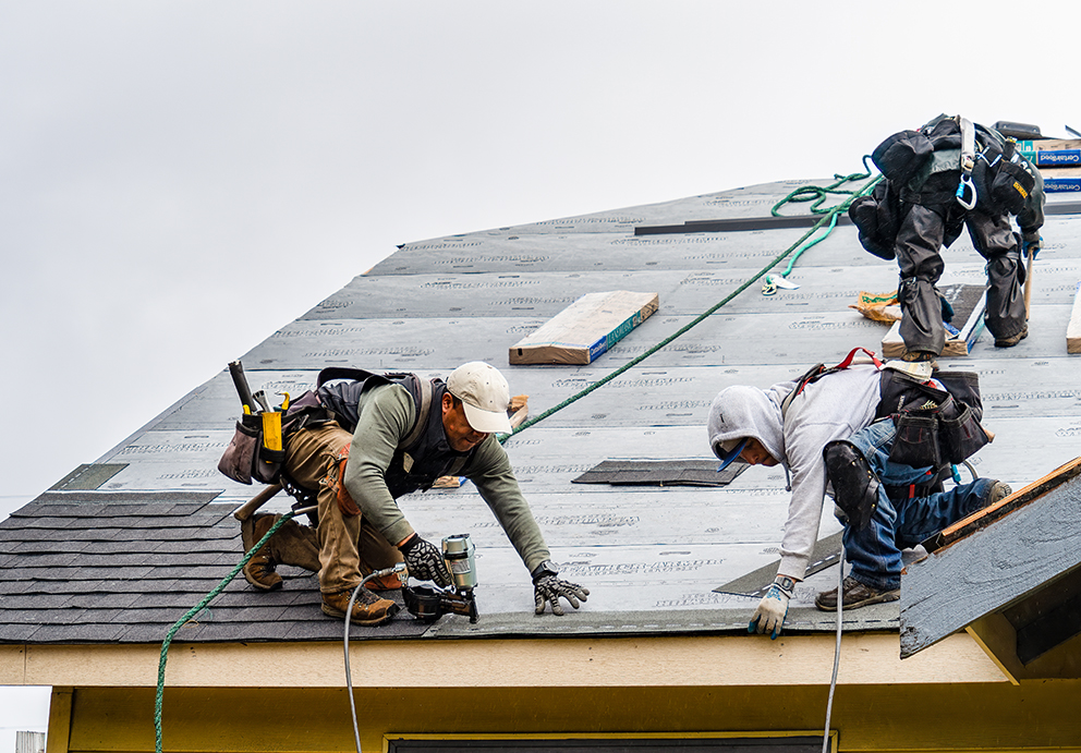 Roofing contractors replacing asphalt shingles in Oxford, WI