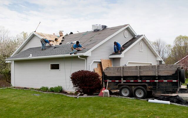 Conover, WI roofing contractors replacing asphalt shingles on single family home