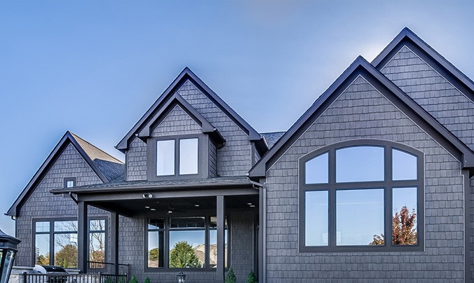 Black fibergalss windows on residential building in Green Bay